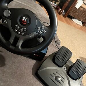 This is the PS4 compatible one Black Gaming Steering Wheel and Pedals Set